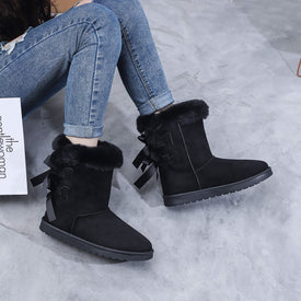 Bottines fourrées en suédine à noeud